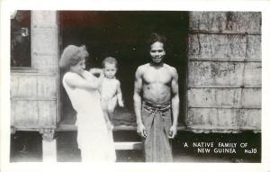1940s RPPC Postcard; Native Family of New Guinea, Hut on Stilts, Grogan No.10
