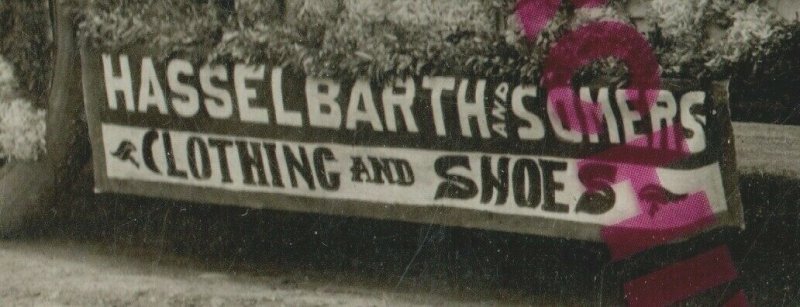 International Falls MINNESOTA RPPC c1910 PARADE FLOAT Car HASSELBARTH CLOTHING