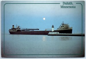Postcard - A giant freighter enters the Duluth Canal - Duluth Minnesota