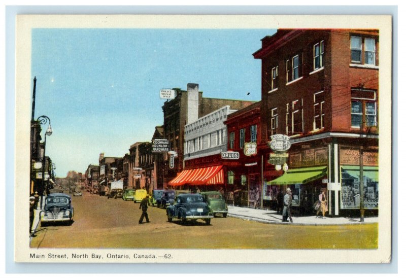 c1940's Main St. North Bay Ontario Canada Hardware, Cigar Store, Police Postcard