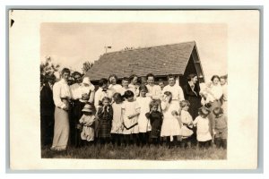 Vintage 1910's RPPC Postcard of Large Family in Front of Farmhouse