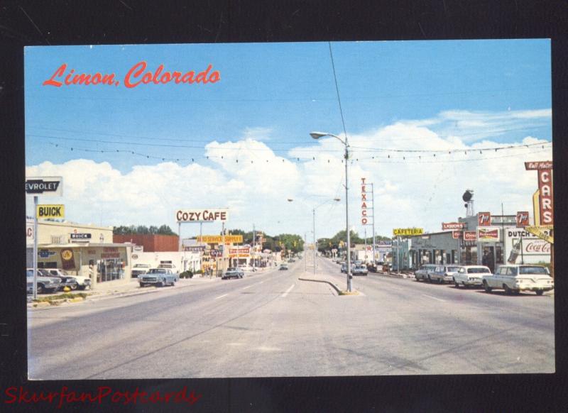 LIMON COLORADO 1960's CARS STREET SCENE CHEVROLET CAR DEALER POSTCARD 7up SIGN