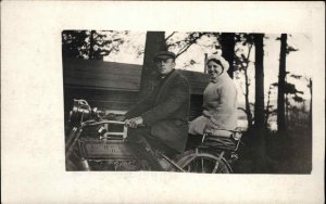 Man & Woman Sitting on Harley Davidson Motorcycle c1910 Real Photo Postcard