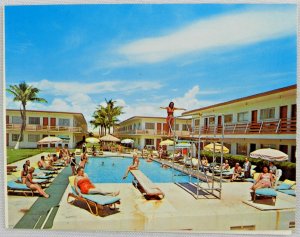 Group of Women Laying Around Safari Motel Pool Miami Beach, FL Vintage Postcard