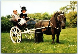 M-57513 Children in Frisian traditional costume