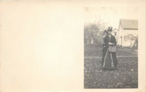 c1910 RPPC Real Photo Postcard Woman Purse Handbag Standing With Giant Fan