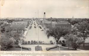 Pocahontas Iowa~Main Street South~Storefronts~Water Tower~1940s Cars Parked~RPPC