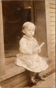 RPPC Child Sitting on Front Step of House Vintage Postcard U75