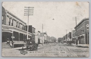 Parkersburg Iowa~Main Street Businesses~Hotel on Corner~Fella on Steps~c1910