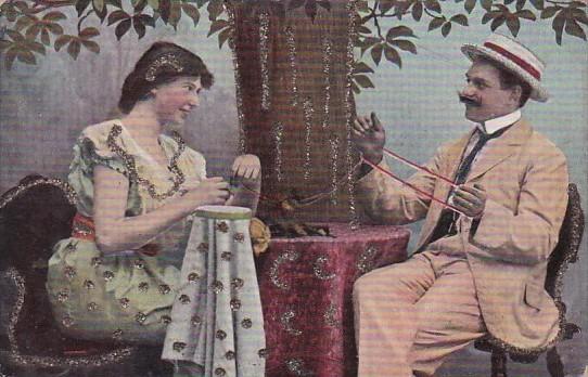 Romantic Couple Sitting At Table With Yarn