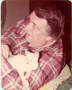 4 Snapshots of Man Loving His Siamese Kitten At Christmas Time