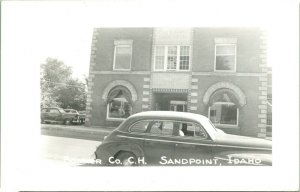 Vtg Postcard RPPC Sandpoint Idaho ID Bonner County Courthouse Street View Car