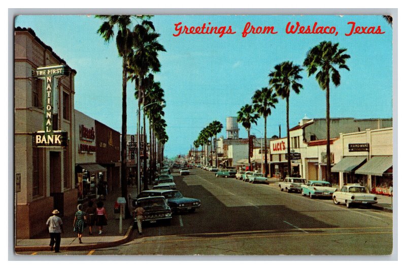 Postcard TX Greetings From Weslaco Texas Old Cars Signs Storefronts Texas Avenue 