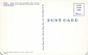 Rawlins WY Storefronts Business Section Trucks Postcard 