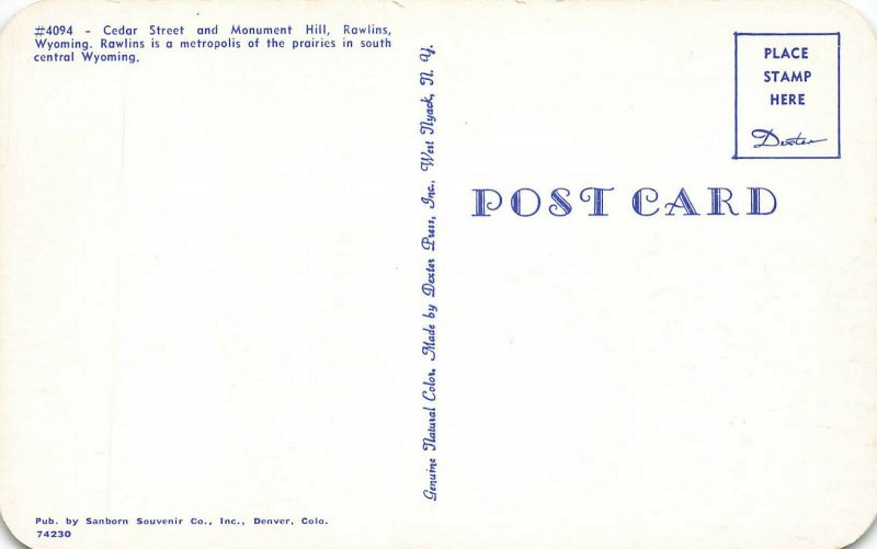 Rawlins WY Storefronts Business Section Trucks Postcard 