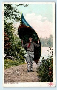 NEW YORK ~ AN ADIRONDACK CARRY~ Man Carries CANOE  c1910s Detroit Postcard