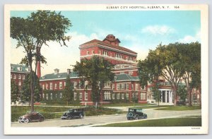 Albany City Hospital~New York~Cars On Street~Bldg In Bkgd Thru Trees~Vintage PC