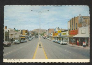 RAWLINS WYOMING DOWNTOWN STREET SCENE OLD CARS STORES VINTAGE POSTCARD