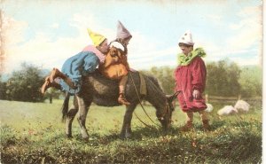 Clown children s paying  on donkey Nice old vintage english postcard