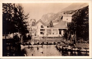 Real Photo Postcard Little Boy Canoeing Outside Pullen House in Skagway, Alaska