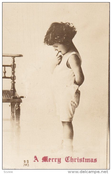 CHRISTMAS; Little Boy wearing a romper acting shy, PU-1921