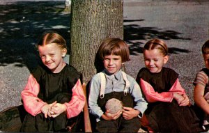 Pennsylvania Lancaster Amish Children Relaxing Under Tree