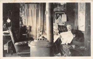 H59/ Alaska? RPPC Postcard c1910 Interior Home Parlor Stove Man Sofa