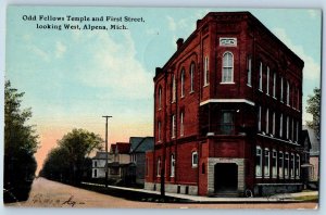 Alpena Michigan Postcard Odd Fellows Temple And First Street Looking West 1912