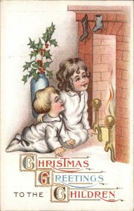 Christmas Little Boy and Girl Fireplace Santa Claus c1910 Vintage Postcard