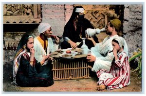 c1910's A Familiar Dinner Native Woman Traditional Dress Egypt Antique Postcard 