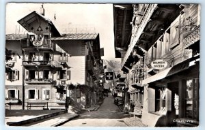 RPPC Champéry street scene Hotel Suisse 1957 Postcard