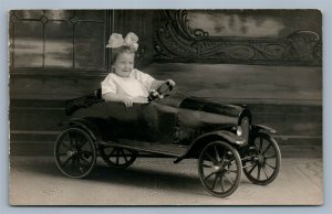 BABY GIRL IN TOY CAR ANTIQUE REAL PHOTO POSTCARD RPPC