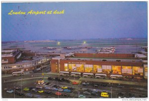 London Airport at dusk , showing Queen's and No.1 Buildings , England , PU-1970