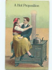 Pre-Linen ROMANTIC COUPLE SITTING ON ANTIQUE STOVE AC5129