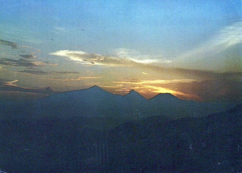 VINTAGE POSTCARD CONTINENTAL SIZE SUNSET ON THE VOLCANO AT KARISIMBI RWANDA