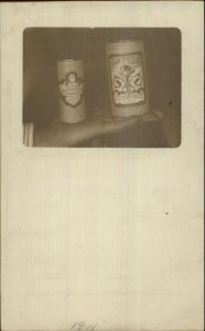 Man Holds Talcum   Powder Canisters in Hand CRAIG'S of Clinton KY c1910 RPPC