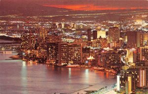 HI, Hawaii  WAIKIKI BEACH & DOWNTOWN HONOLULU At SUNSET  c1950's Chrome Postcard