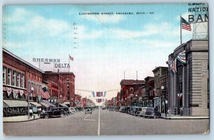 1941 Ludington Street Classic Cars US Flags Buildings Escanaba Michigan Postcard