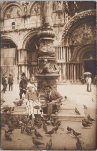 Man and Woman Feeding Pigeons Birds Venice Italy Marco Venezia RPPC Postcard H51