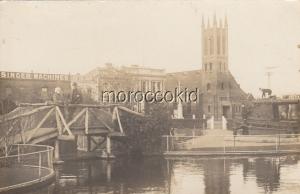 PALMERSTON-NORTH, NEW ZEALAND RPPC POSTCARD w CHURCH, SINGER SEWING MACHINE SIGN