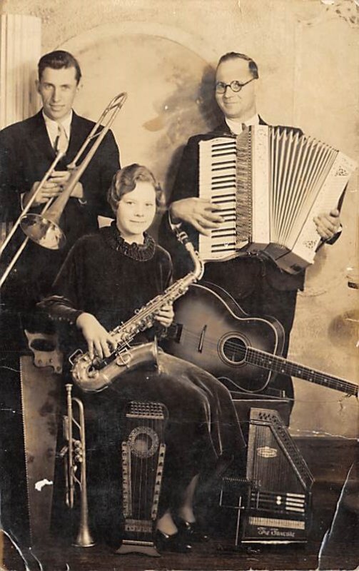 a woman and 2 men playing instruments Music Unused 