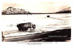 Army Trucks Crossing the Frozen Surface of the White River - Alaska AK