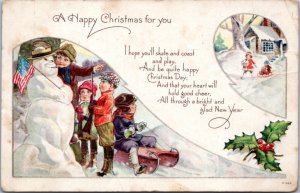 Postcard Patriotic Christmas Children playing with snowman holding flag