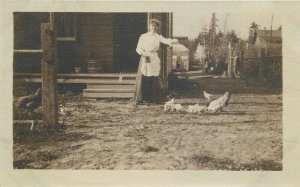 Postcard C-1910 Woman feeding backyard chickens rural life 23-12532