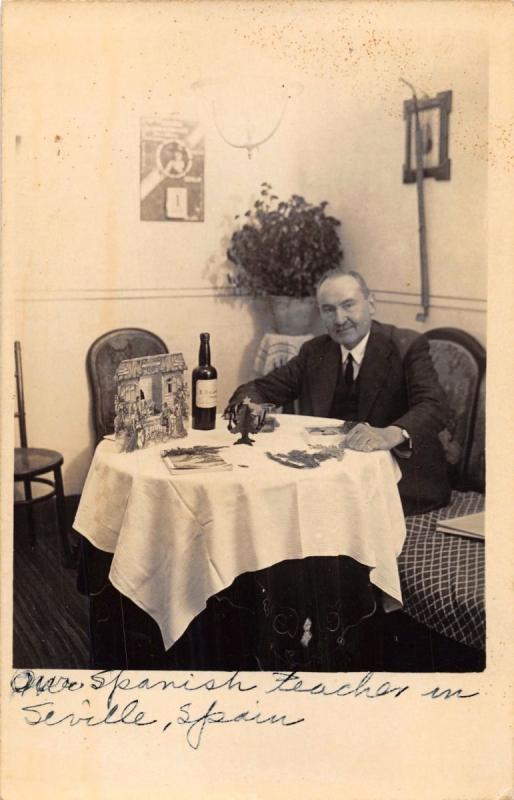 SEVILLE SPAIN MALE SPANISH TEACHER~CRECHE~WINE BOTTLE REAL PHOTO POSTCARD