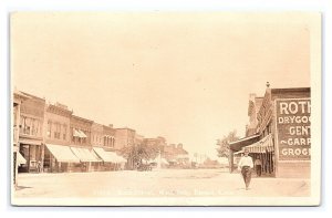 Postcard Main Street West Side Russel (Russell) Kans. Kansas RPPC c1911 Postmark