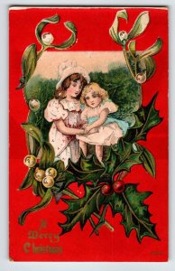 Christmas Postcard Children Girls Holly Leaves Embossed Greetings Vintage Unused
