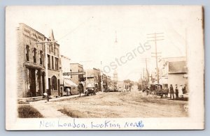 J90/ New London Wisconsin RPPC Postcard c1910 Stores Church Men  37