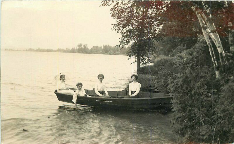 Lakeshore woman rowboat C-1910 RPPC Photo Postcard 21-13052