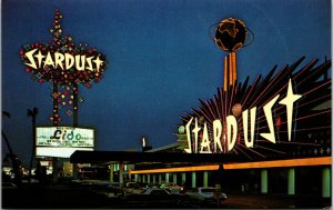 Postcard Stardust Hotel at Night in Las Vegas, Nevada~1041